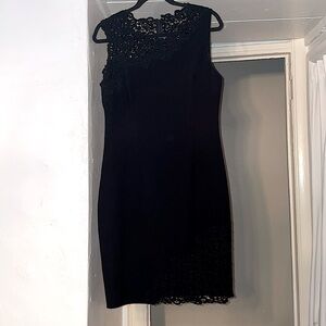 Elie Tahari black dress with lace top and lace insert ant bottom right hem.